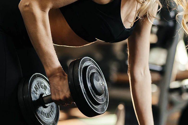 Woman Lifting Weights with Ultra K Usage
